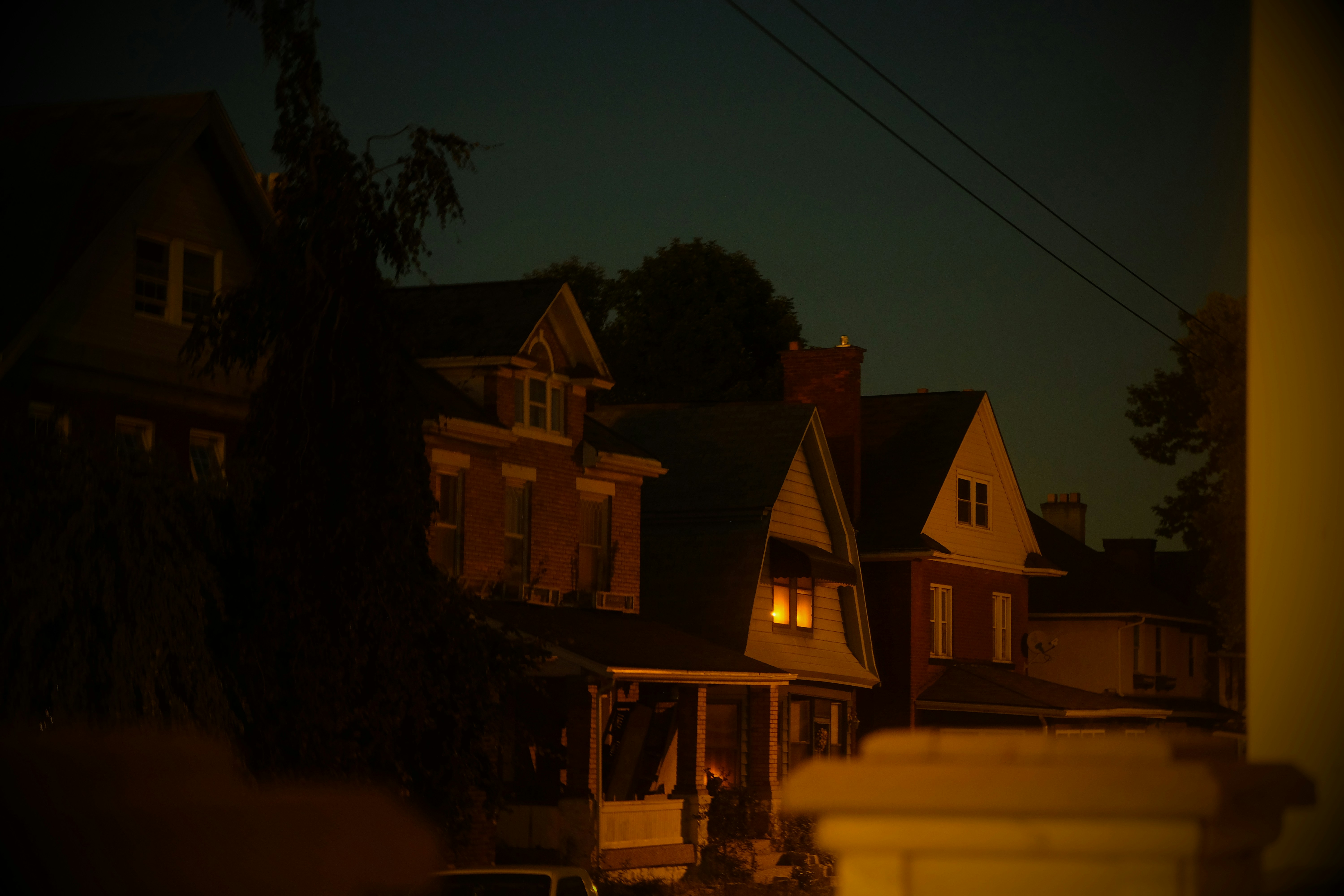 safe, well-lit neighborhood street at dusk - community camera