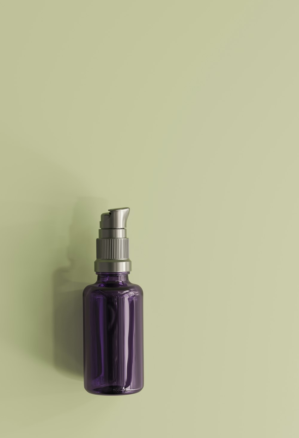a purple glass bottle with a silver top