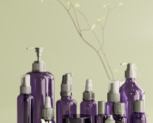 a group of purple bottles sitting on top of a table