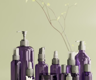 a group of purple bottles sitting on top of a table