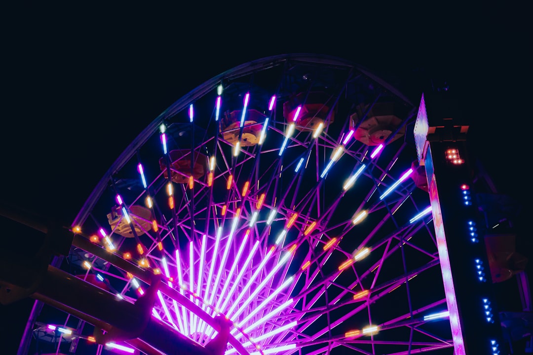 blue and red ferris wheel during nighttime
