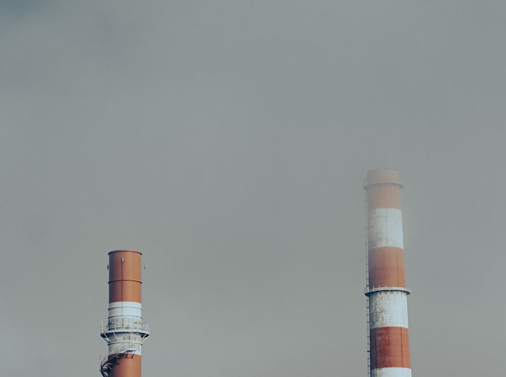 white and brown tower under gray sky