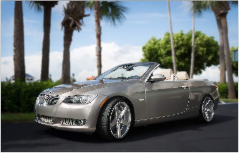 grey BMW convertible coupe on road during daytime