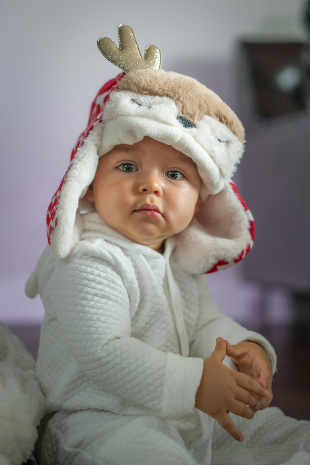 baby in white hoodie jacket