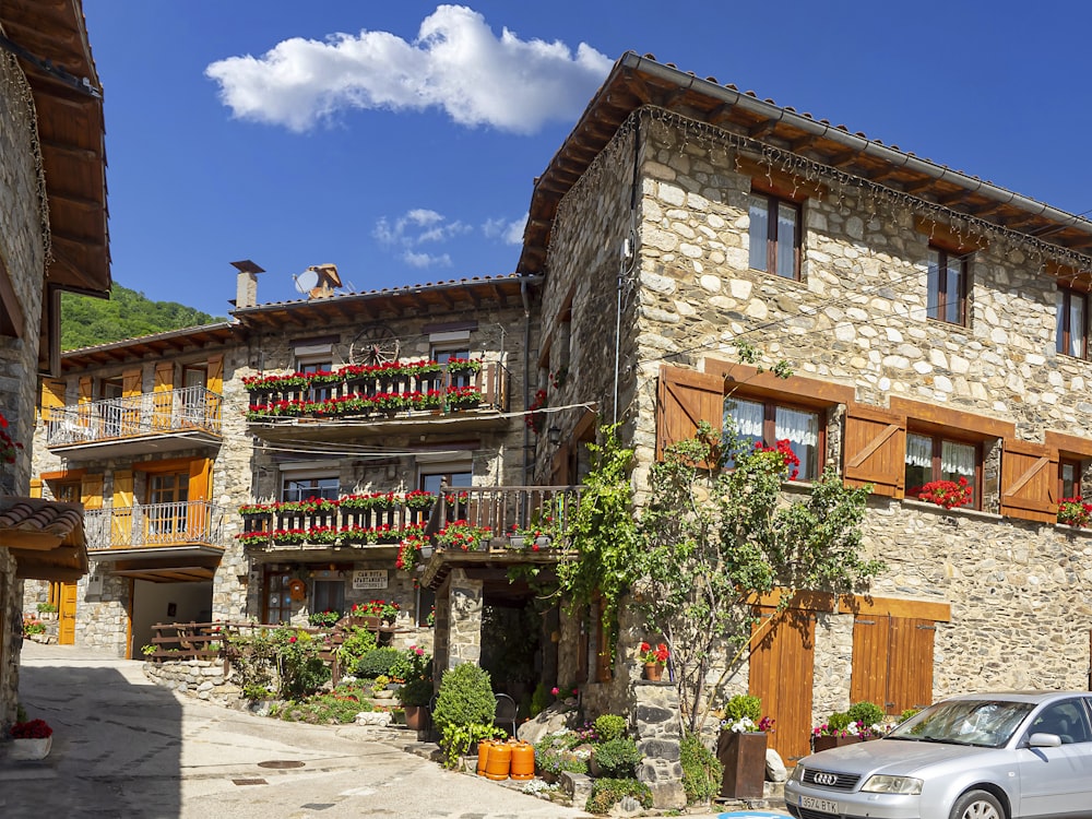 a car parked in front of a stone building