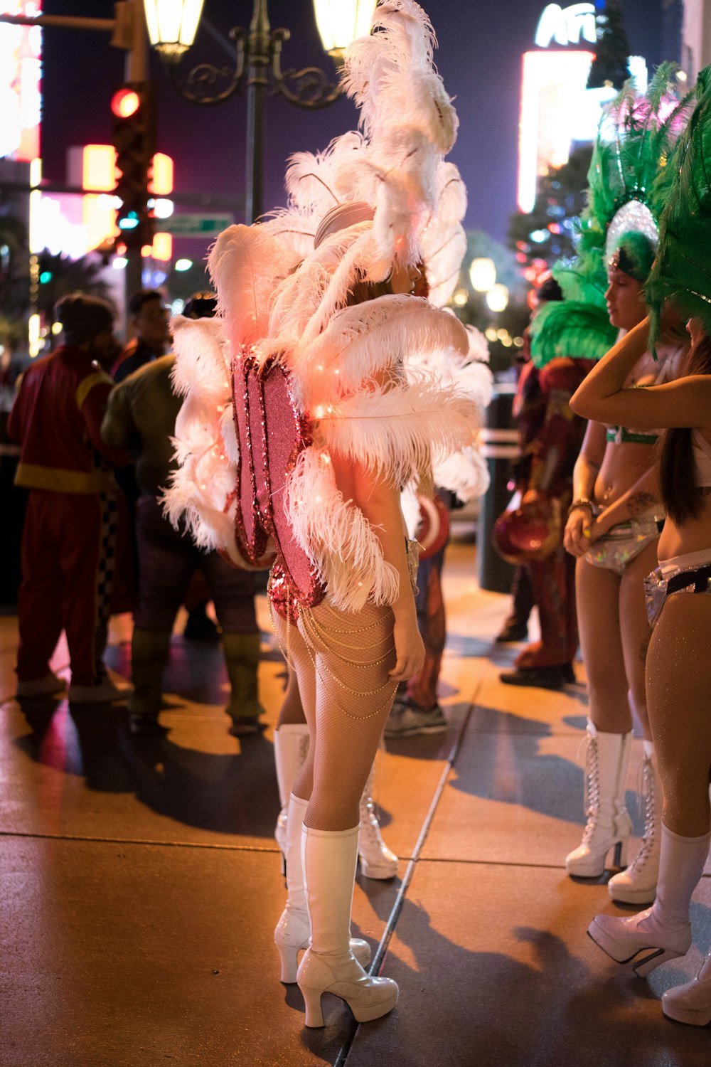 woman in green wig and white stockings standing on brown wooden floor