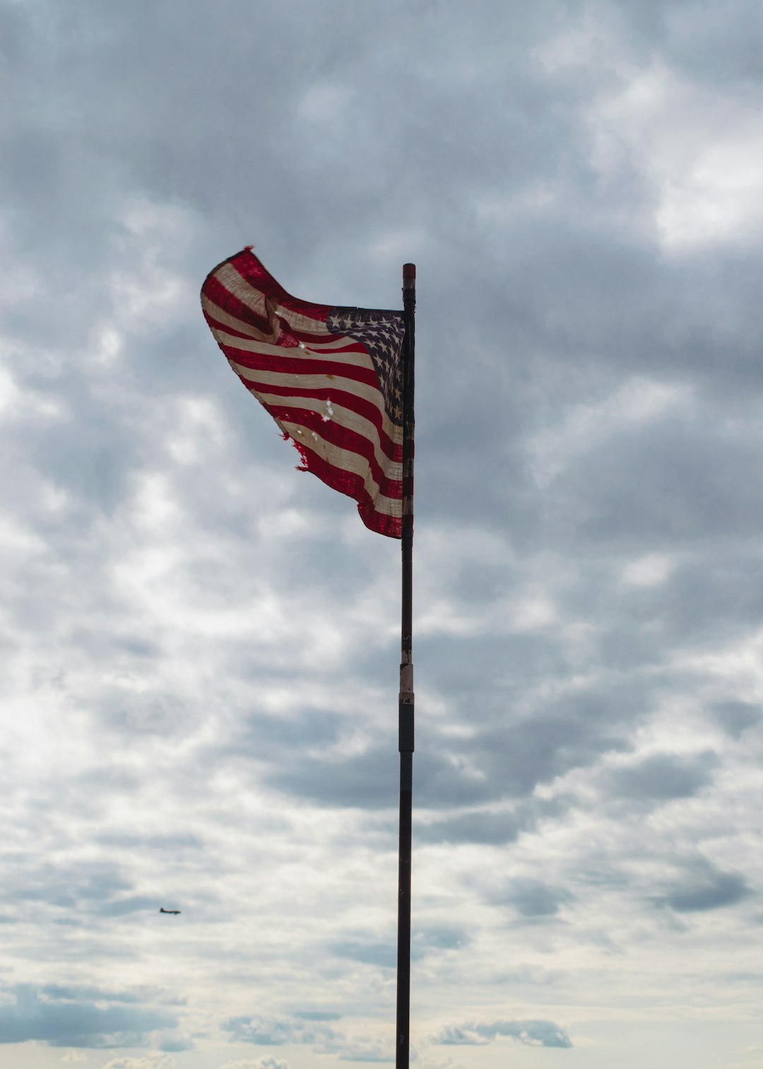 us a flag under cloudy sky