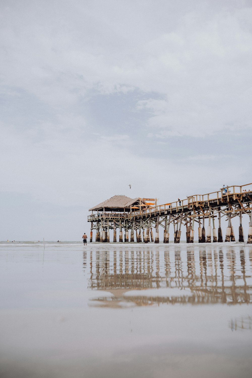 a wooden pier sitting on top of a body of water