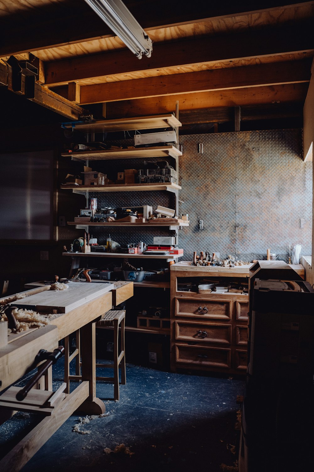 a kitchen with a lot of clutter on the counter