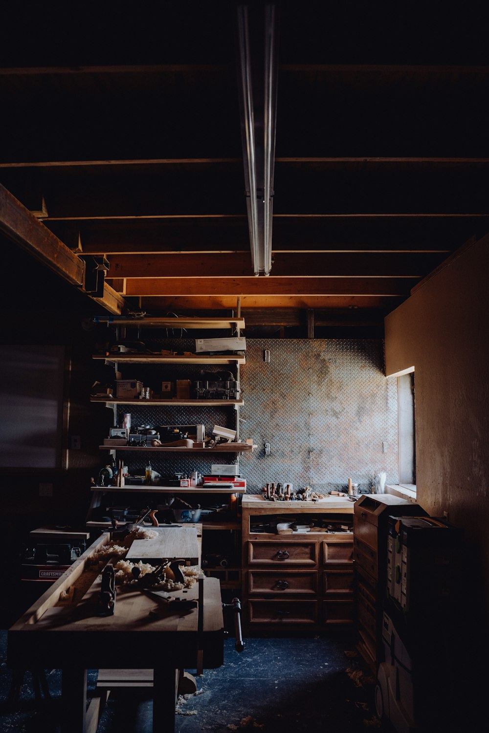 a kitchen with a lot of clutter on the counter