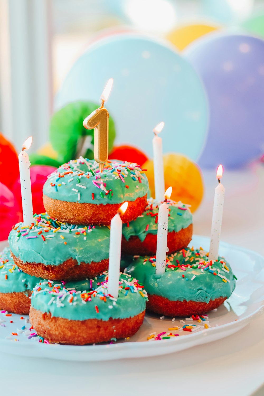 pink and brown cake with candles