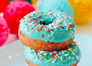 brown and pink doughnut with strawberry on top