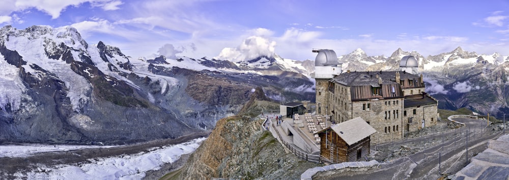 a large building sitting on top of a mountain