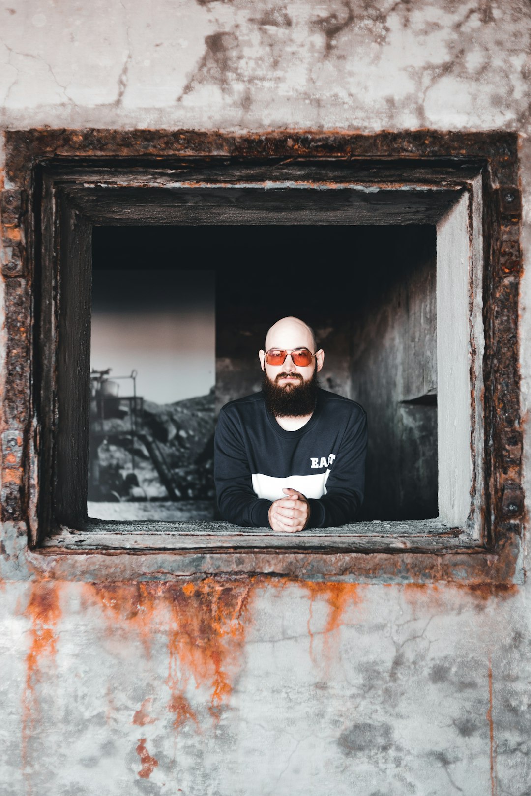 man in black long sleeve shirt wearing black sunglasses