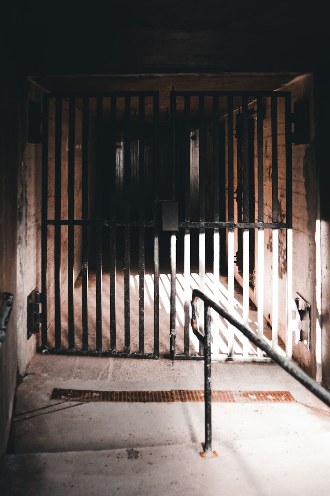 brown wooden door on gray concrete wall