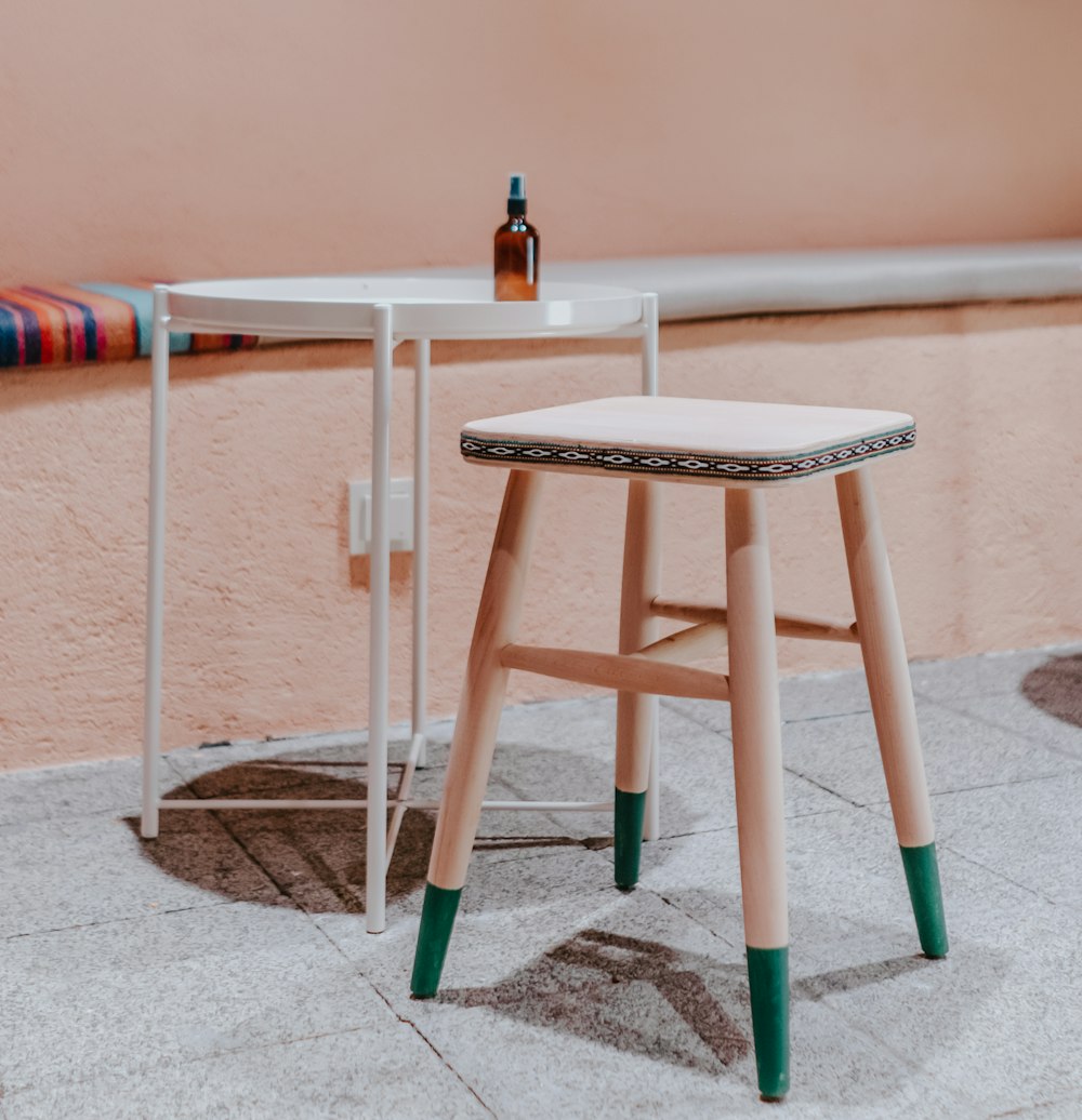 brown wooden seat beside white table