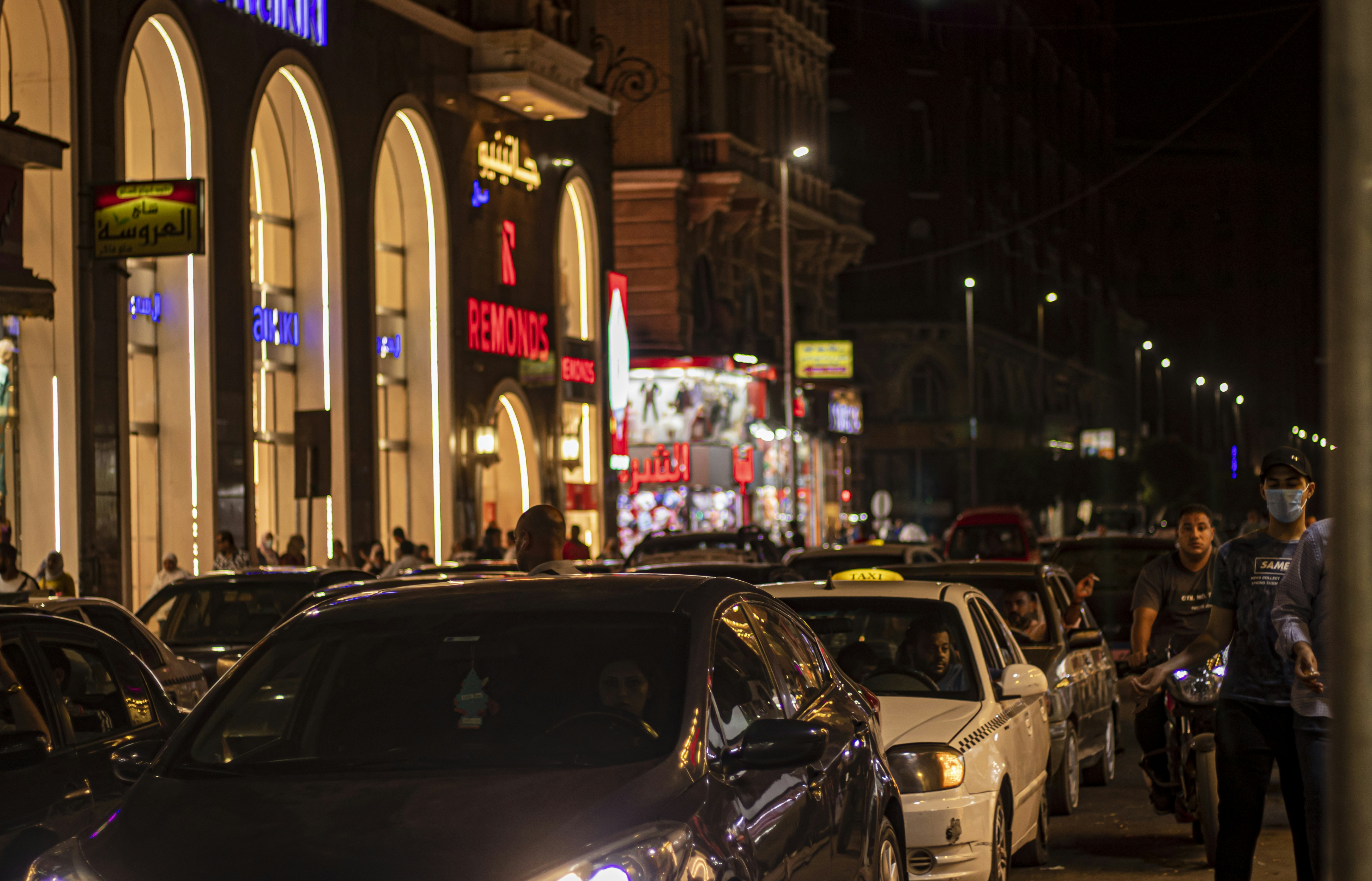 a city street filled with lots of traffic at night