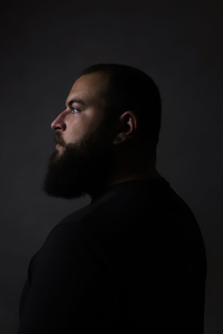 a man with a beard and a black shirt