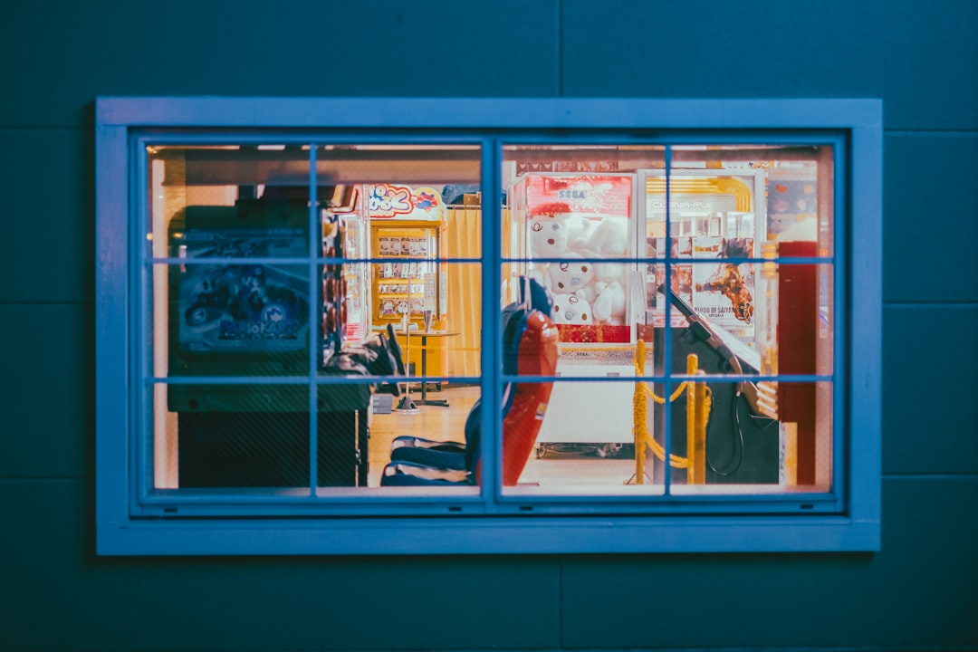 woman in red dress standing in front of store