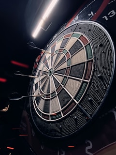 a close up of a dart board in a room