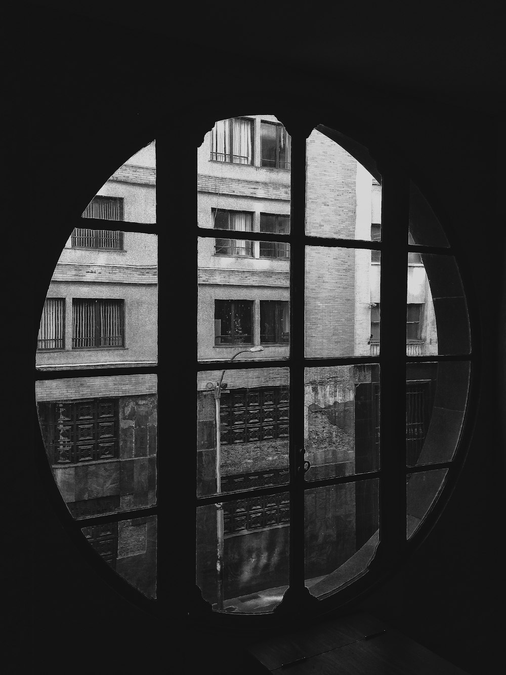 grayscale photo of glass window