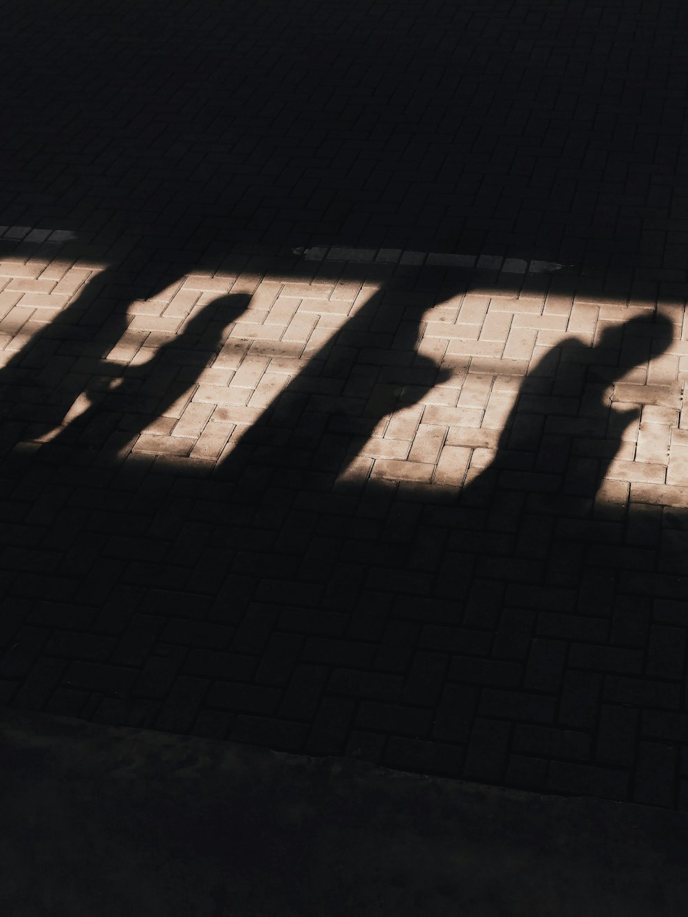 shadow of person on white concrete wall