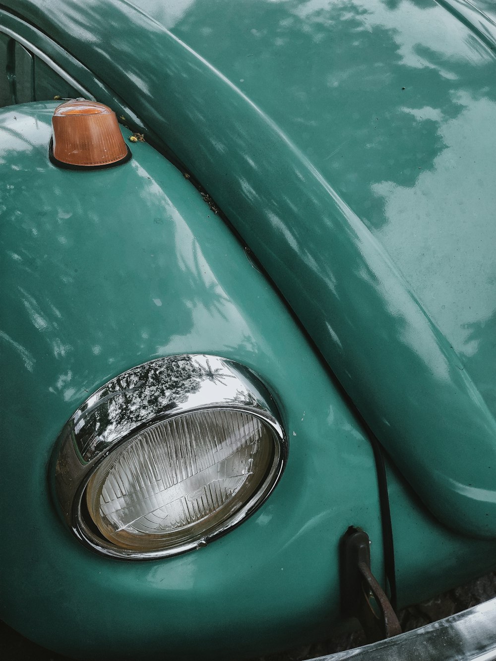 green car with white and orange light