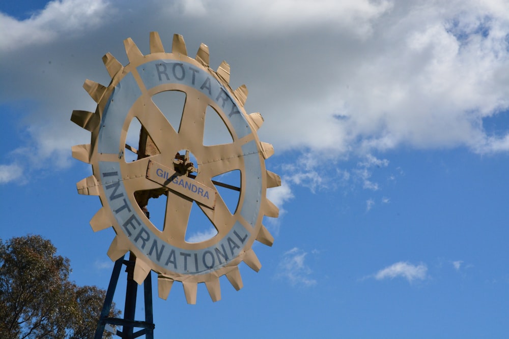 white and black round analog clock under blue sky during daytime