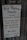 A sign for 'The West Wyalong Advocate' newspaper, detailing publication days as Tuesdays and Fridays. The sign includes the street address, telephone and fax numbers, and office hours from Monday to Friday, 8 am to 5 pm. The background consists of a reflective glass surface with metal rivets at the top corners.