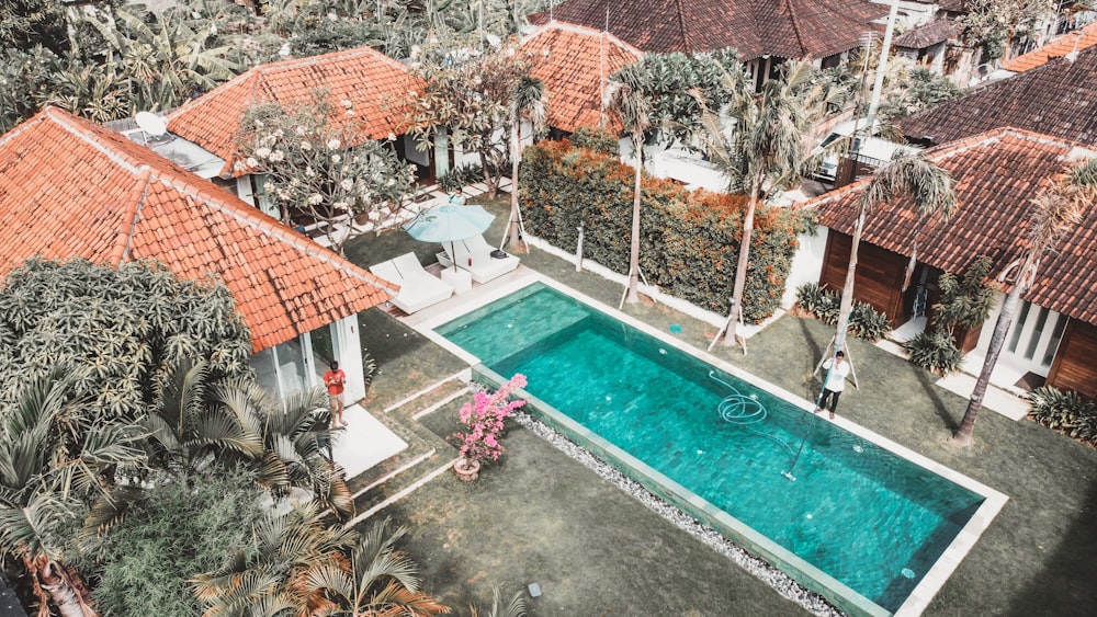 an aerial view of a house with a swimming pool