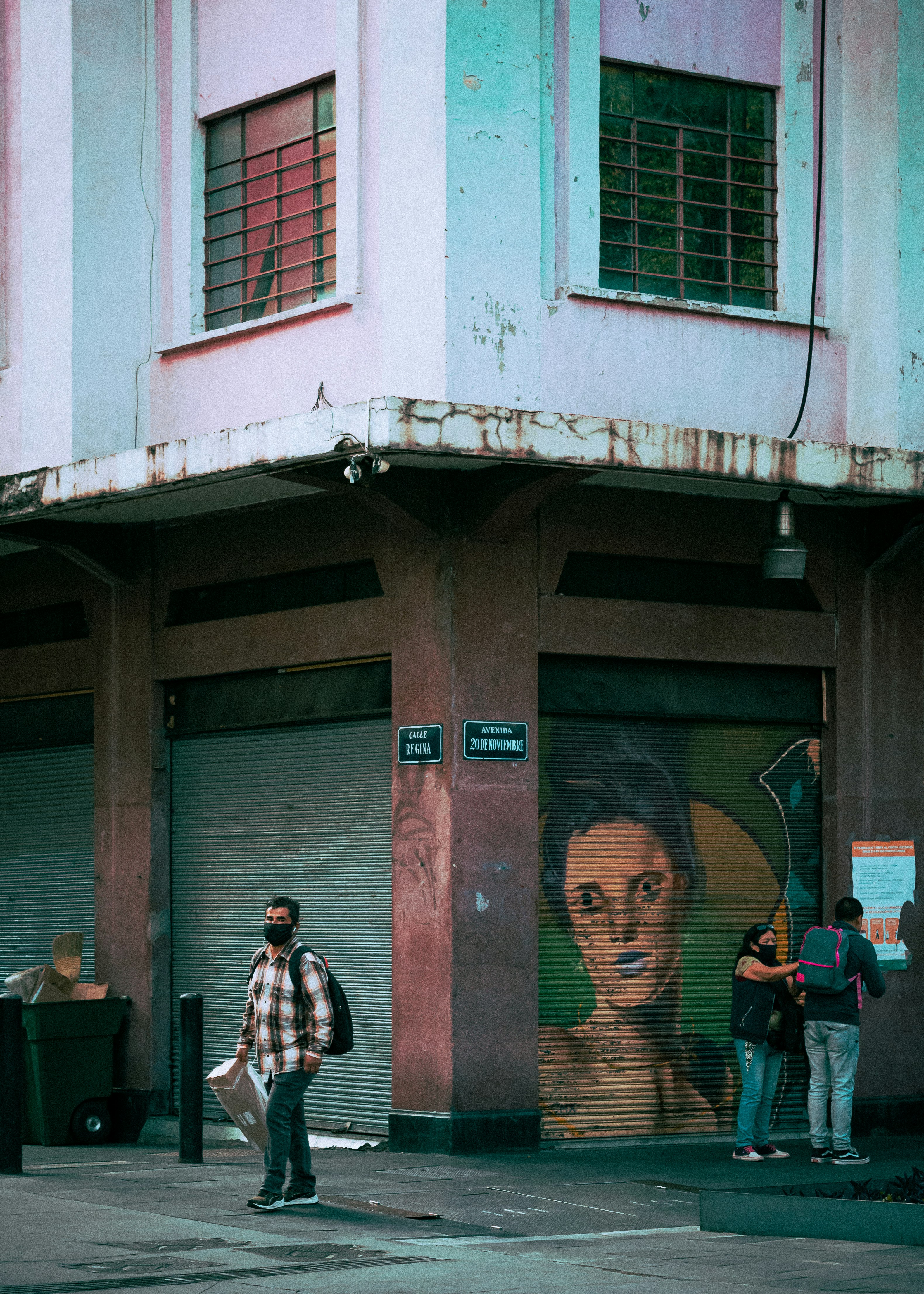 people standing near brown wooden door during daytime