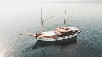 a boat floating on top of a large body of water