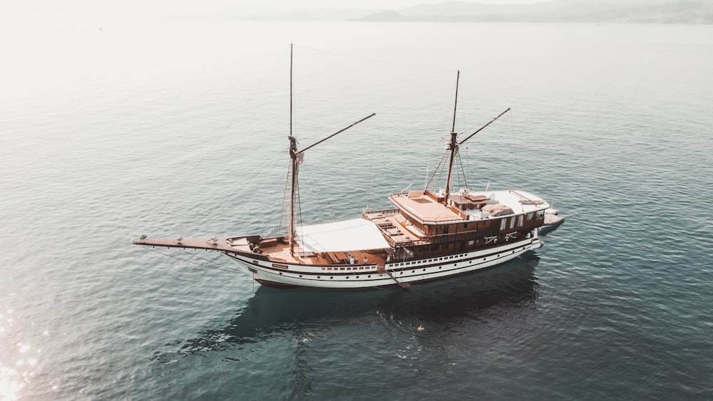 a boat floating on top of a large body of water