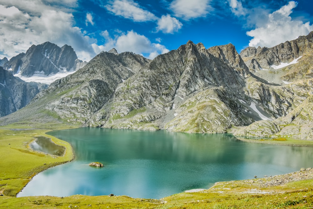 lake in the middle of mountains