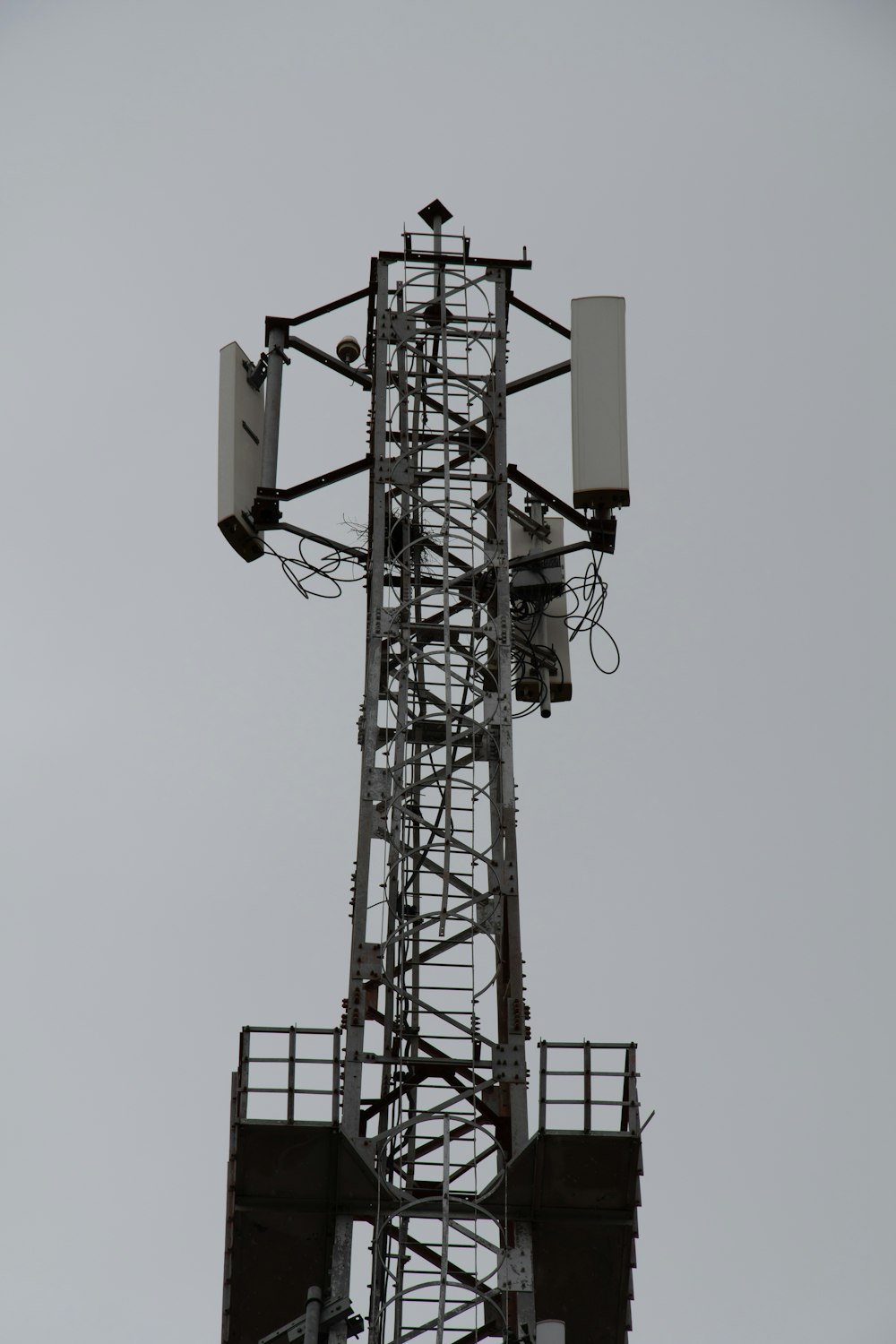a tall tower with a couple of antennas on top of it