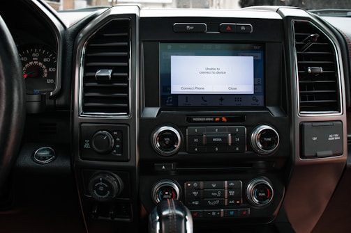 Automotive embedded controller integrated into a vehicle dashboard.