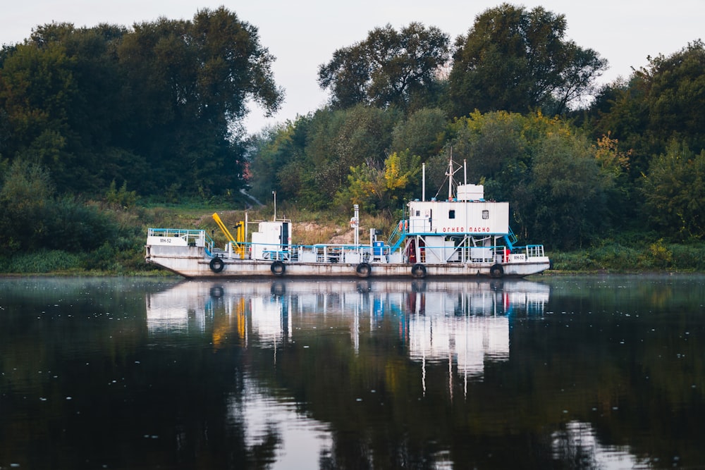 a large boat floating on top of a lake