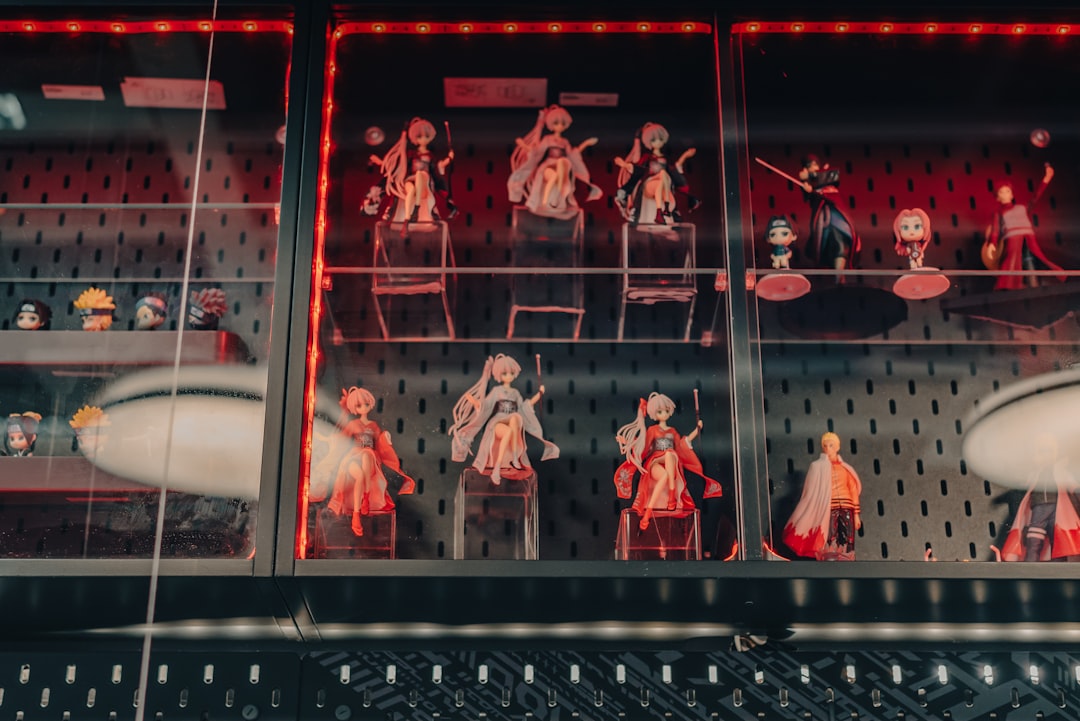 people in red and white shirts standing on glass window