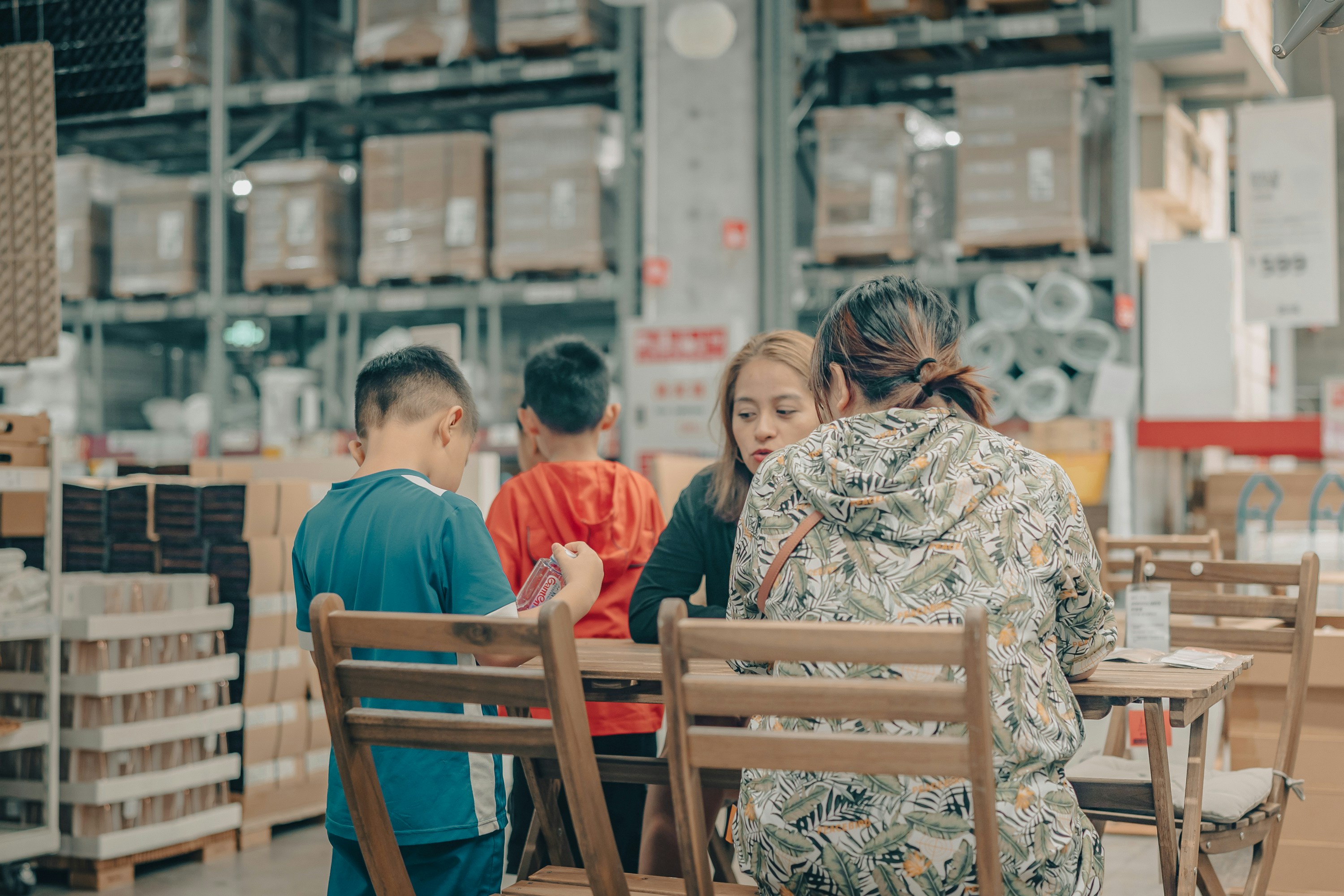 people sitting on brown wooden chairs during daytime