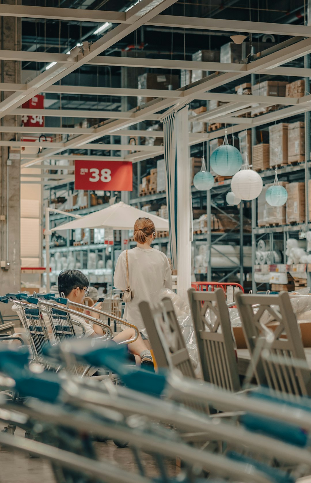 people sitting on chair near store during daytime