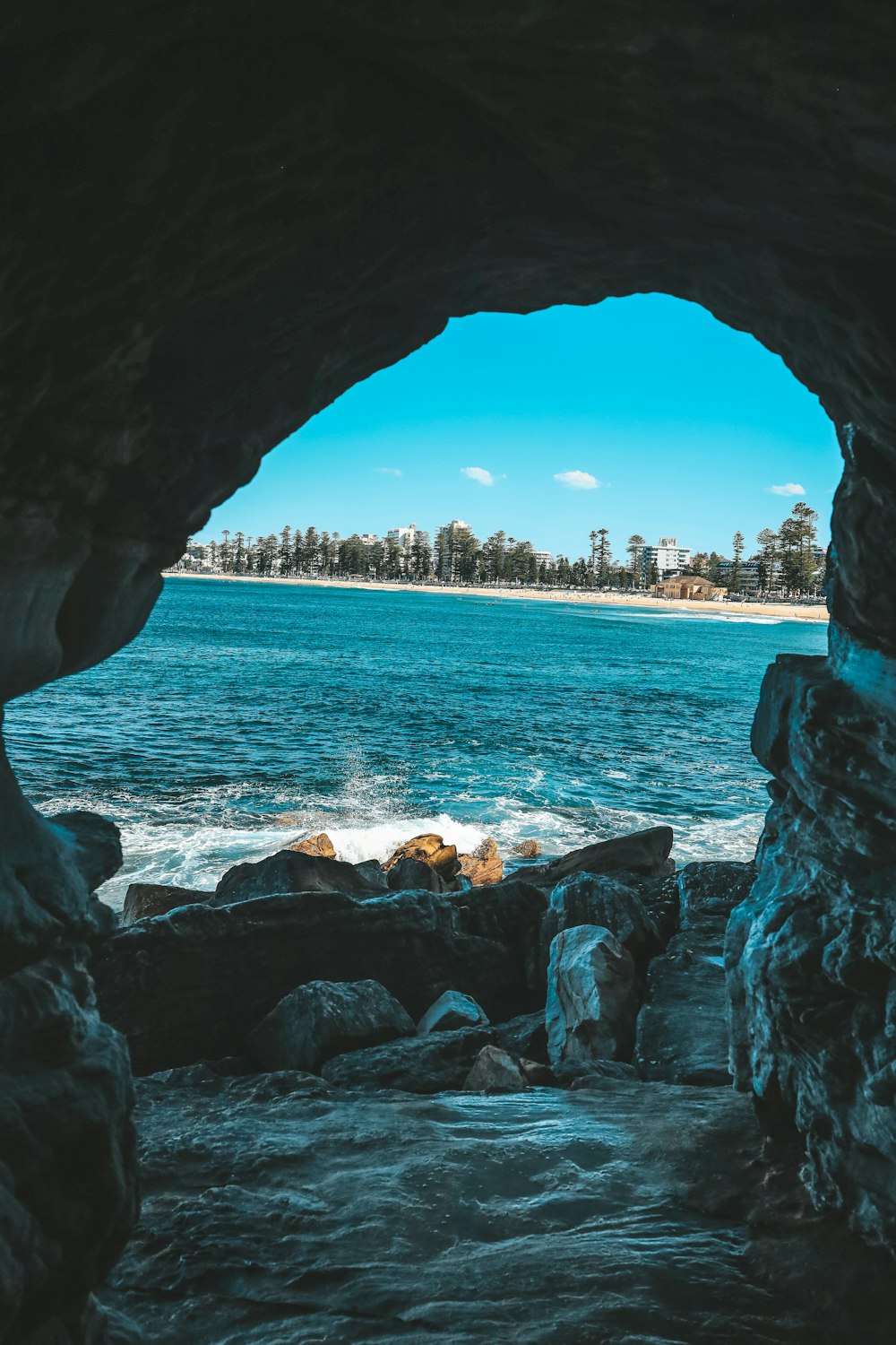 rocky beach shore with blue sea water during daytime