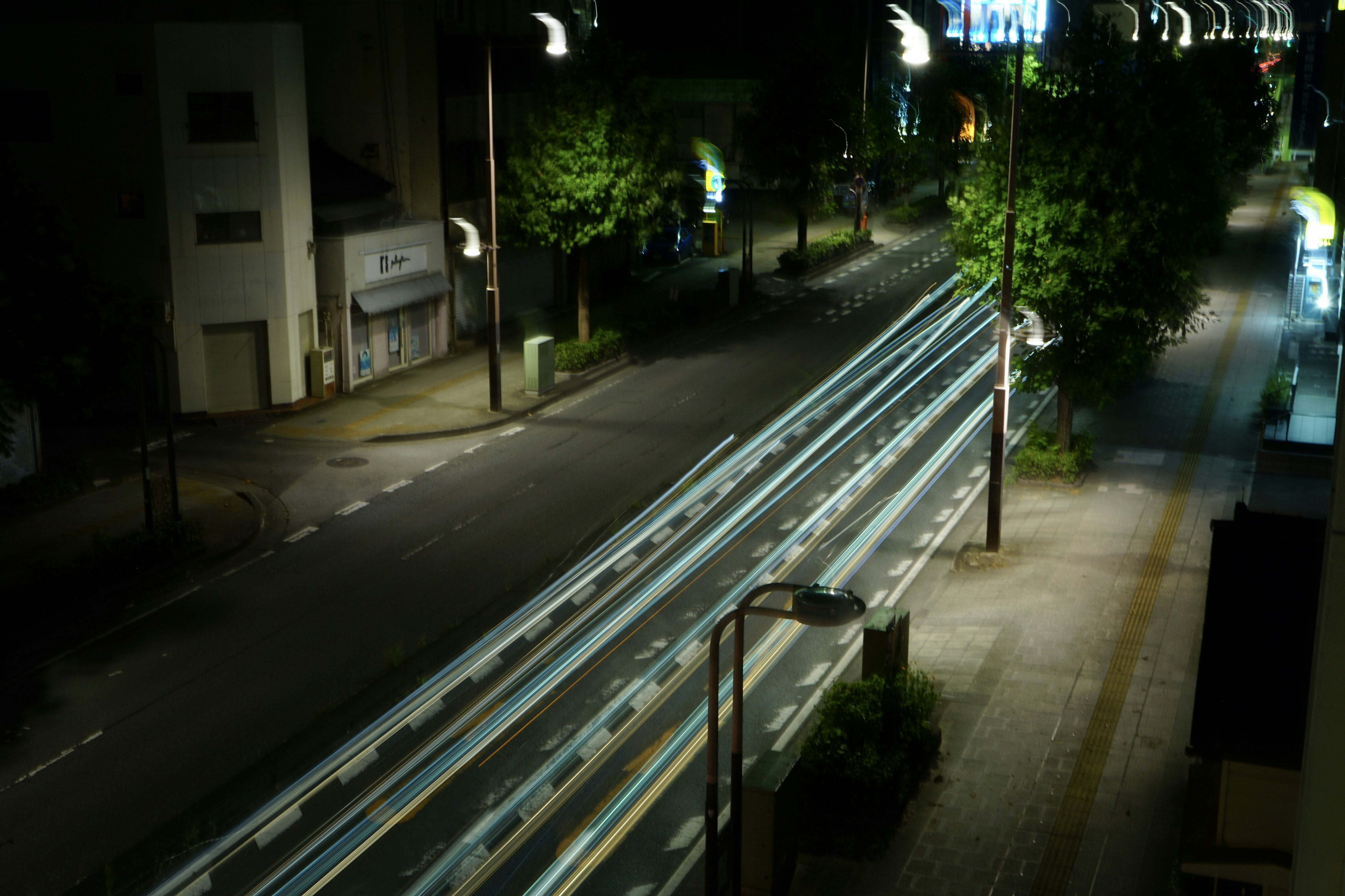 a city street at night with a lot of traffic