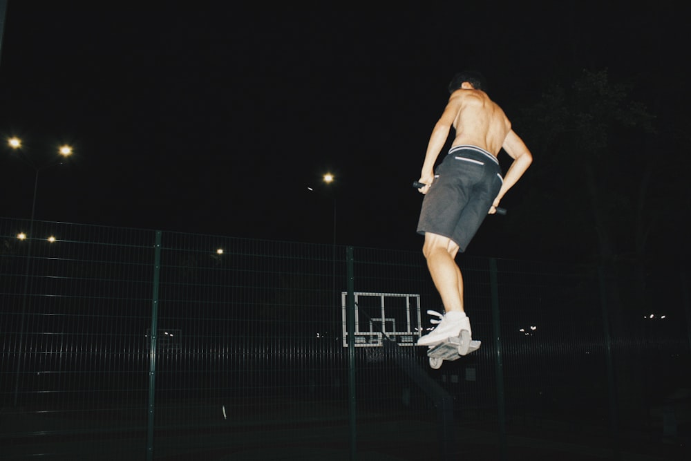 a man is doing a trick on a skateboard