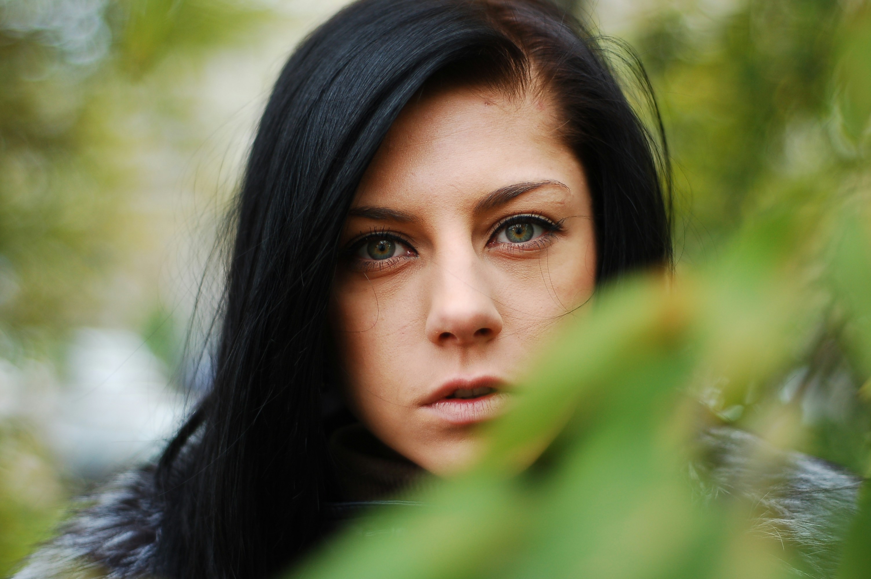 a close up of a person with long black hair