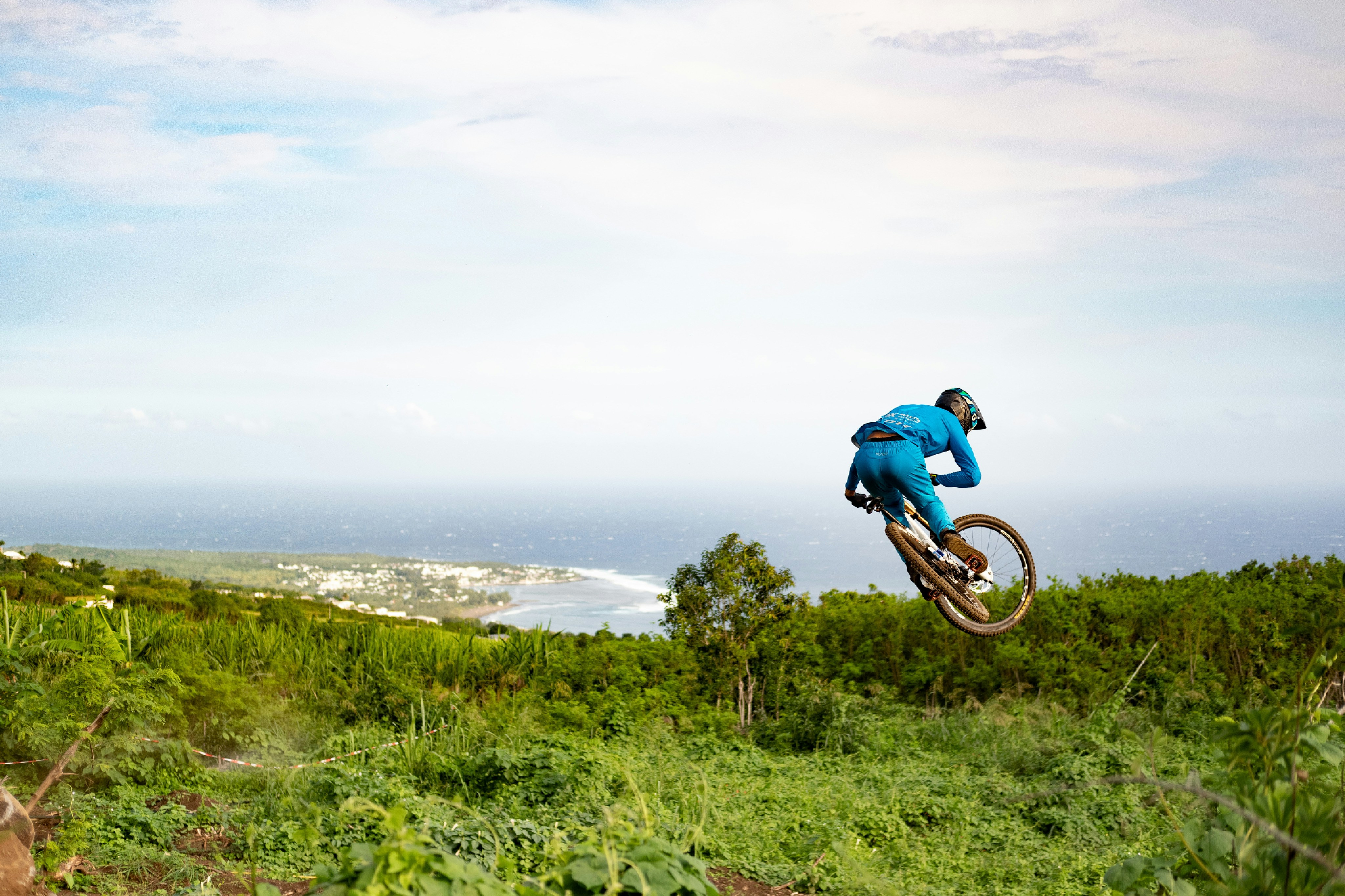 a man riding a bike up the side of a hill