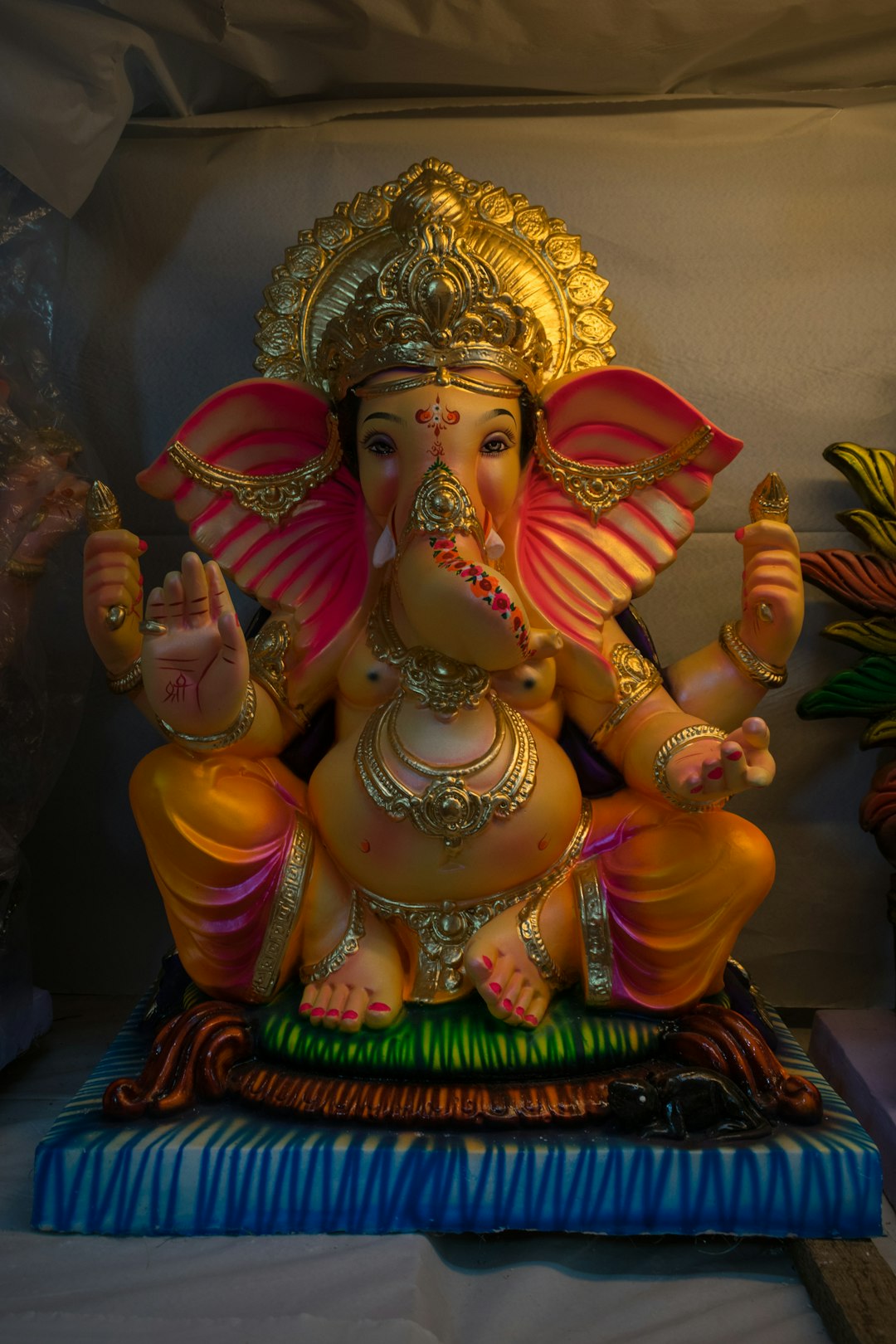 hindu deity figurine on brown wooden table