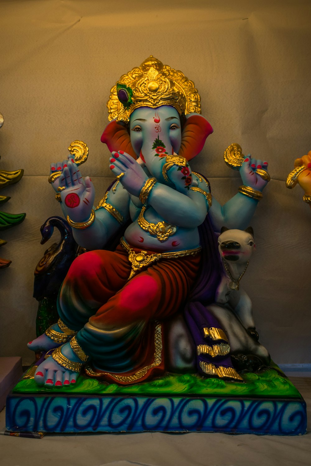 hindu deity figurine on brown wooden table