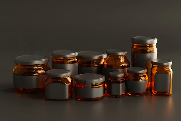 a group of jars with lids on a table