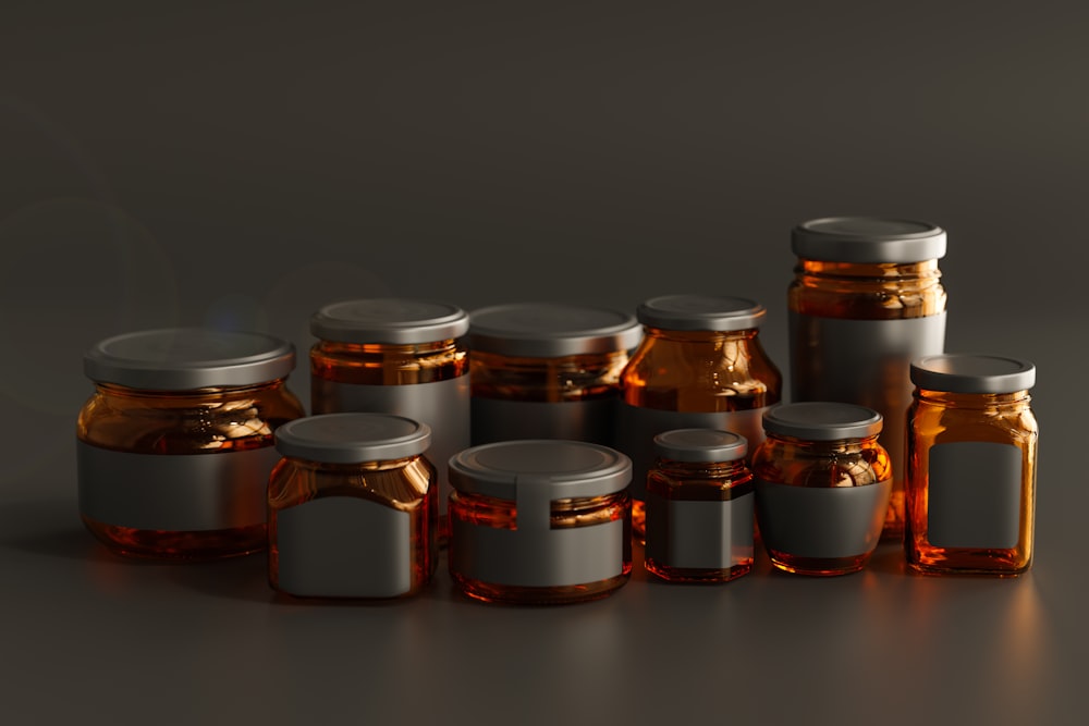 a group of jars with lids on a table