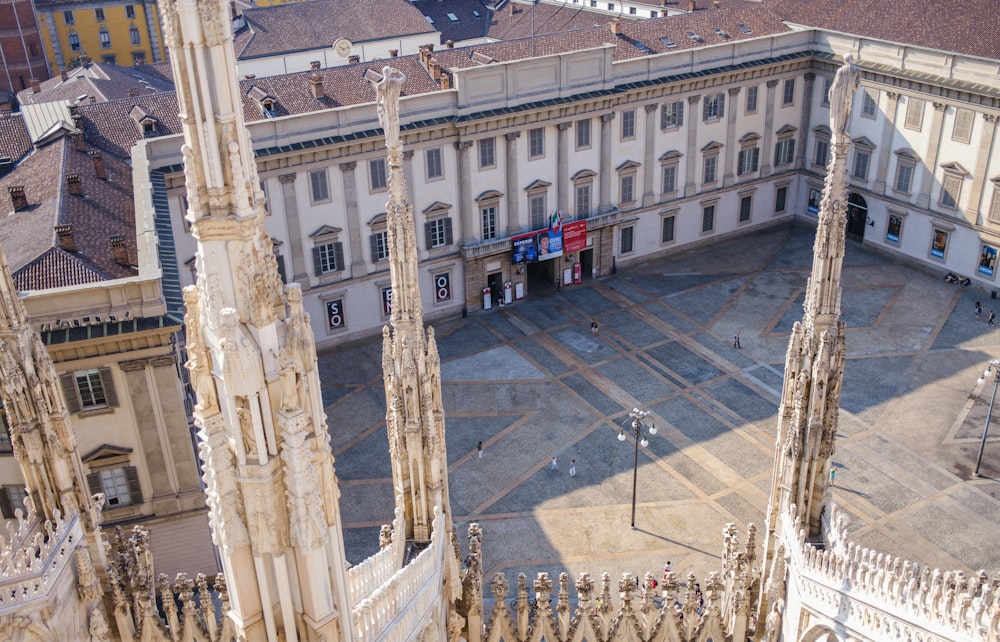 an aerial view of a large building with a clock tower